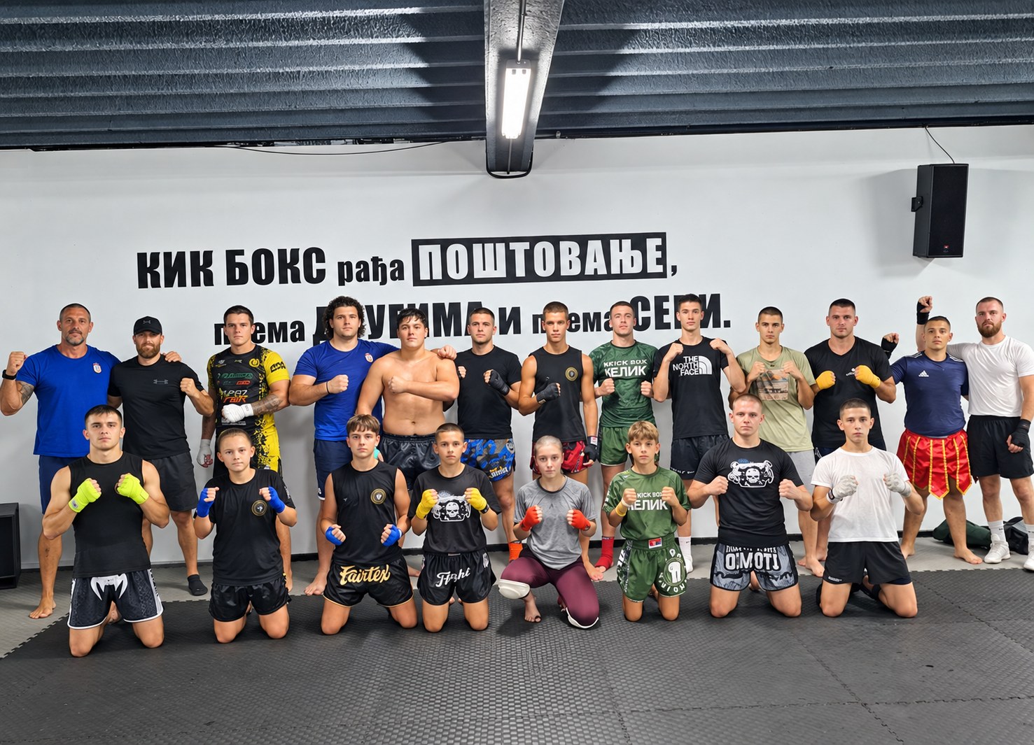 Car Lazar team in front of the club wall